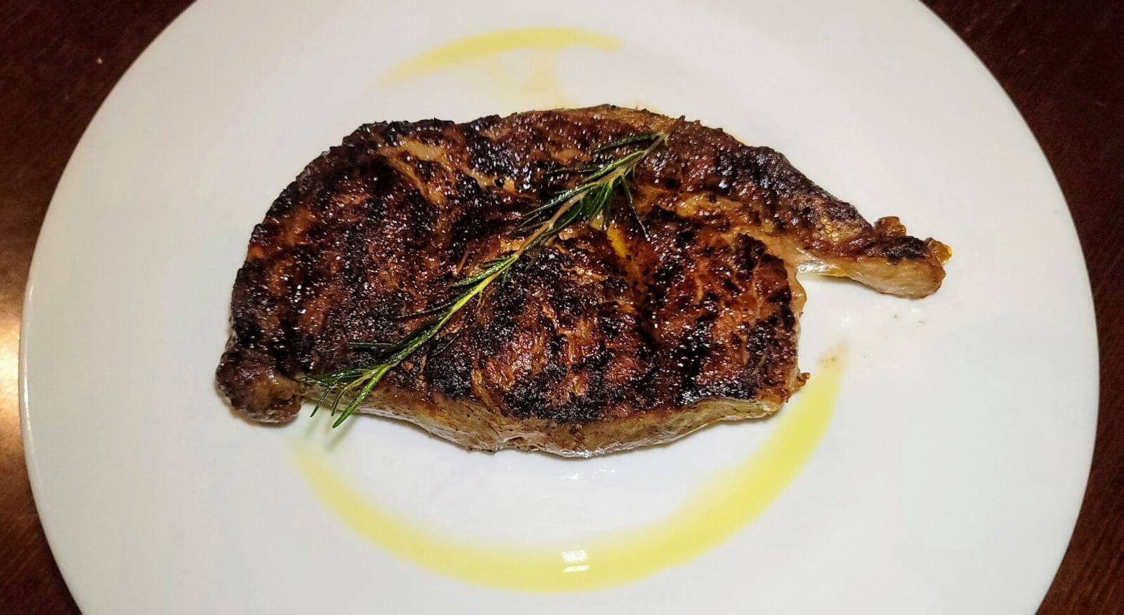 A grilled steak plated at The Fort Steakhouse in Fort Pierce, Florida. 